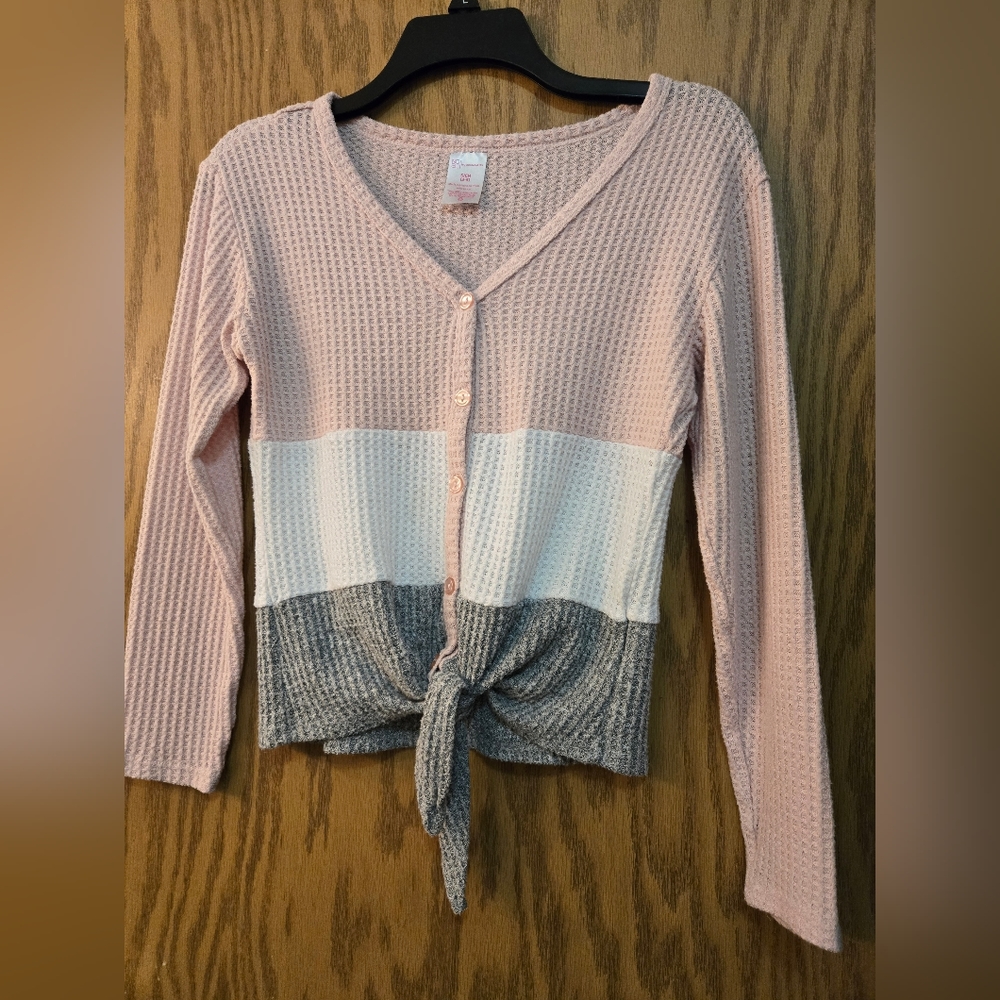 Cute light pink, white and gray, long sleeve blouse with buttons and front tie.